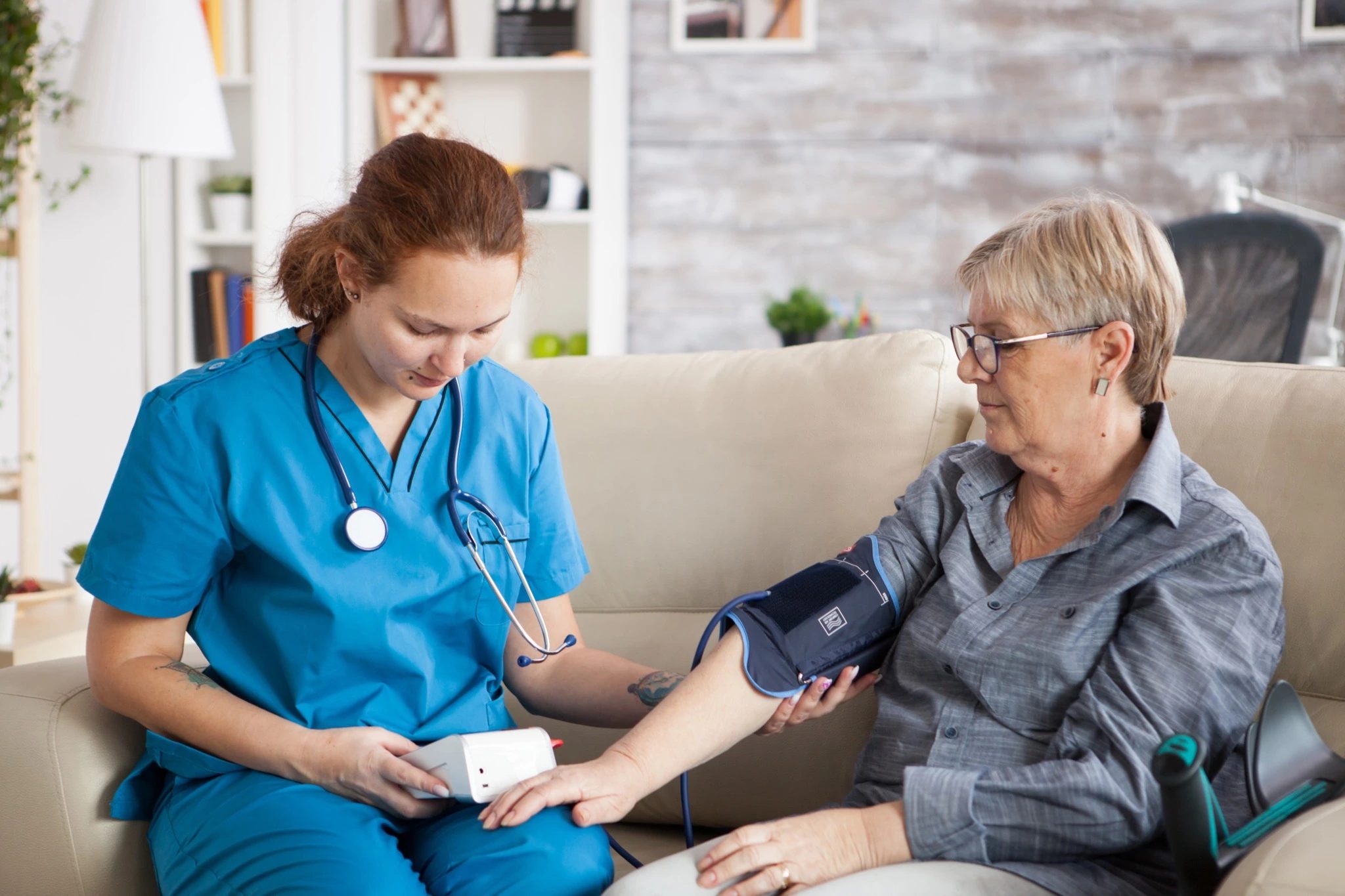 Care professional supporting a patient at home