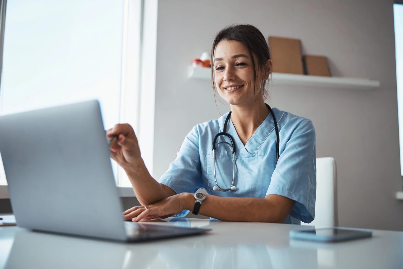 Care coordinator at a laptop